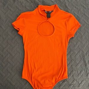 orange bodysuit w/ cleavage